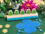 Five frogs on a log