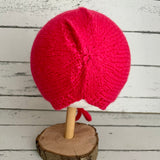Hand knitted bonnet - raspberry pink