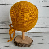 Hand knitted bonnet - mustard