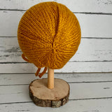 Hand knitted bonnet - mustard