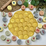 Lowercase alphabet stamping stones