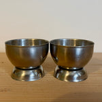 Pair of stainless steel eggcups with a hole in the base (preloved)