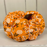 Handmade cotton pumpkin - bright orange background with black and white leaf design