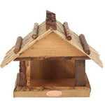 Bird table with thatched roof