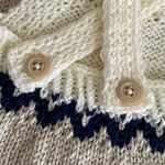 Hand knitted baby romper - cream, navy and taupe colours