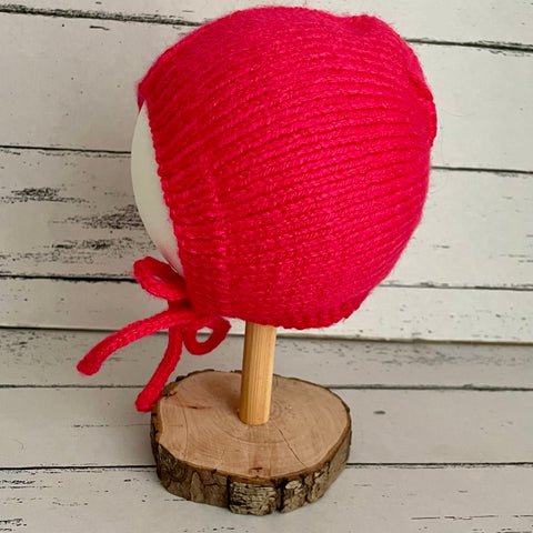 Hand knitted bonnet - raspberry pink
