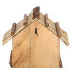 Bird table with thatched roof