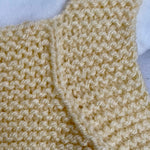 Hand knitted baby romper - cream