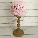 Pink beanie hat with patterned edge