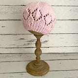 Pink beanie hat with patterned edge