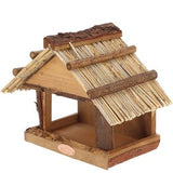 Bird table with thatched roof