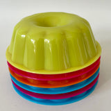 Set of six colourful plastic jelly moulds (preloved)