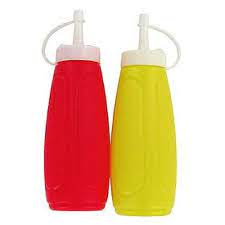 Red and yellow plastic sauce dispensers