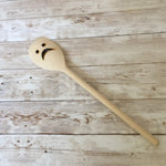 Sad face wooden spoon