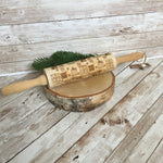 Wooden rolling pin engraved with presents