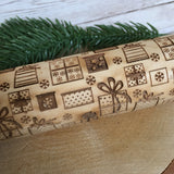 Wooden rolling pin engraved with presents